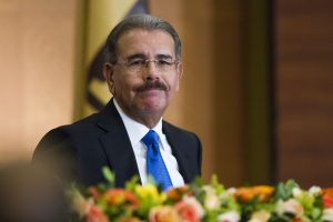 Dominican President-elect Danilo Medina gestures after receiving a certificate from the Central Electoral Board confirming him as new president, during a ceremony in Santo Domingo on June 5, 2012. AFP PHOTO / ERIKA SANTELICES        (Photo credit should read ERIKA SANTELICES/AFP/GettyImages)