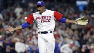 Puerto Rico pitcher Edwin Diaz reacts after getting the last out to defeat the Dominican Republic in a second-round World Baseball Classic game Tuesday, March 14, 2017, in San Diego. Puerto Rico won, 3-1. (AP Photo/Gregory Bull)