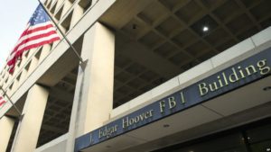 The FBI's J. Edgar Hoover Headquarters, across the street from the Justice Department in Washington, Wednesday, Nov. 2, 2016. (AP Photo/Cliff Owen)