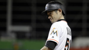 Miami Marlins' Ichiro Suzuki (51) smiles as he stands at first after hitting a RBI single during the fifth inning of a baseball game against the New York Mets, Monday, Sept. 18, 2017, in Miami. The Marlins won 13-1. (AP Photo/Lynne Sladky)