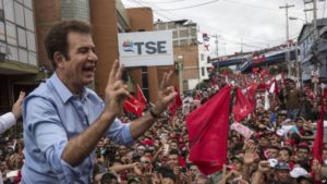 Opposition Alliance presidential candidate Salvador Nasralla greets supporters in front of the Supreme Electoral Tribunal in Tegucigalpa, Honduras, Monday, Nov. 27, 2017. Early results from Honduras' presidential election Monday showed leftist challenger Salvador Nasralla with a surprise lead over incumbent President Juan Orlando Hernandez, both of whom had claimed victory. (AP Photo/Rodrigo Abd)