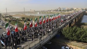 In this photo provided by Mehr News Agency, demonstrators attend a pro-government rally in the southwestern city of Ahvaz, Iran, Wednesday, Jan. 3, 2018. Tens of thousands of Iranians took part in pro-government demonstrations in several cities across the country on Wednesday, Iranian state media reported, a move apparently seeking to calm nerves after a week of protests and unrest that have killed at least 21 people. (Mehdi Pedramkhoo, Mehr News Agency, via AP)