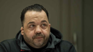 Defendant Niels Hoegel who is charged with the killing of 100 patients as nurse on an intensive care unit waits for the beginning of the third day of his trial in the court in Oldenburg, western Germany, Thursday, Nov. 22, 2018. (Mohssen Assanimoghaddam//pool photo via AP)
