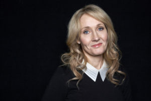 FILE - In this Oct. 16, 2012, file photo Harry Potter novels author J.K. Rowling poses for a photo at an appearance at The David H. Koch Theater in New York. Rowling is to receive the PEN/Allen Foundation Literary Service Award, PEN America told The Associated Press on Monday, Jan. 25, 2016. (Photo by Dan Hallman/Invision/AP, File)