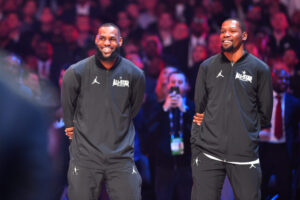 February 18, 2018; Los Angeles, CA, USA; Team LeBron forwards LeBron James of the Cleveland Cavaliers (23) and Kevin Durant (35) of the Golden State Warriors react before the 2018 NBA All Star Game at Staples Center. Mandatory Credit: Bob Donnan-USA TODAY Sports