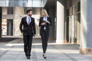10 Mar 2015 --- Business partners walking by office building --- Image by © Hudolin-Kurtagic/Lumi Images/Corbis