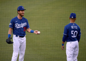 LOS ANGELES, CALIFORNIA - JULY 08:  Cody Bellinger #35 of the Los Angeles Dodgers and Mookie Betts #50 talk during the Los Angeles Dodgers summer camp workout in preparation for the 2020 season amidst the coronavirus (COVID-19) pandemic at Dodger Stadium on July 08, 2020 in Los Angeles, California. (Photo by Harry How/Getty Images)